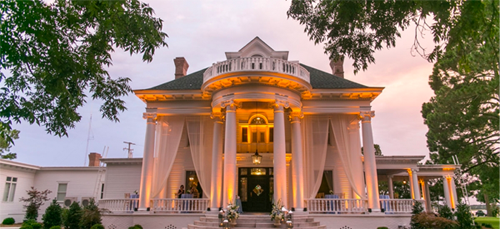 Image of the river forest manor's front porch, lit up and ready for an event