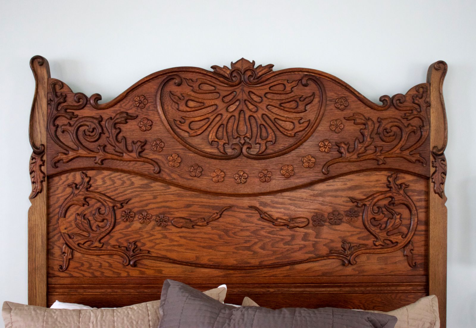 Image of an intricate wooden headboard used for the site